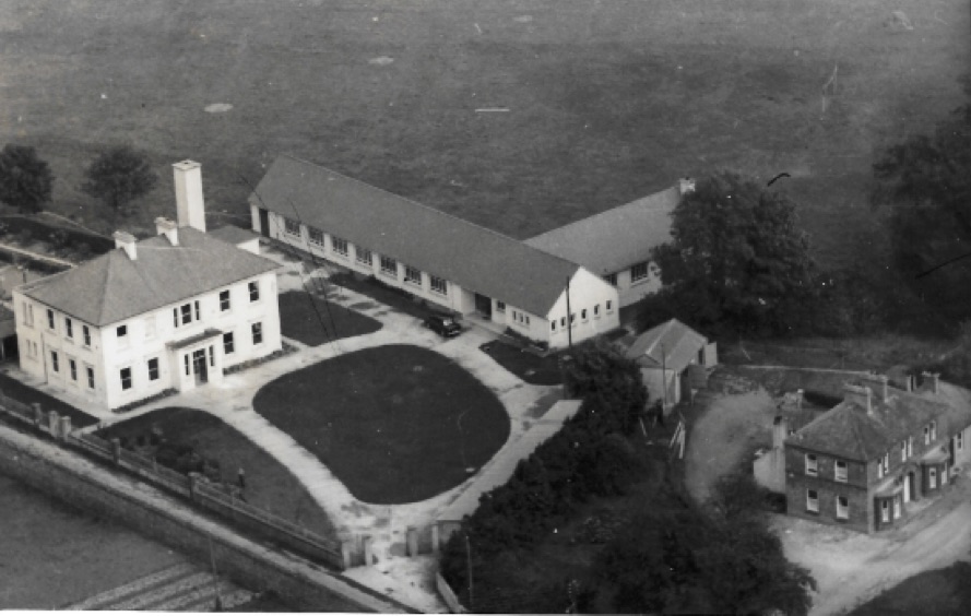 0014 : An aerial view of the school in 1956, shows the building extension which was completed in 1955. The presbytery house can be seen on the right of the picture.